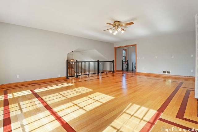 spare room featuring hardwood / wood-style flooring and ceiling fan