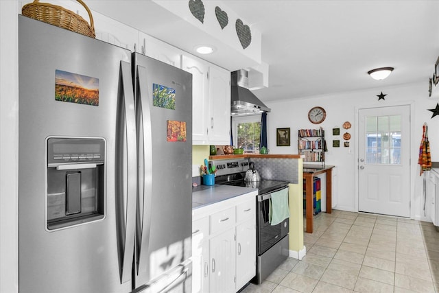 kitchen featuring white cabinetry, a healthy amount of sunlight, appliances with stainless steel finishes, and wall chimney range hood