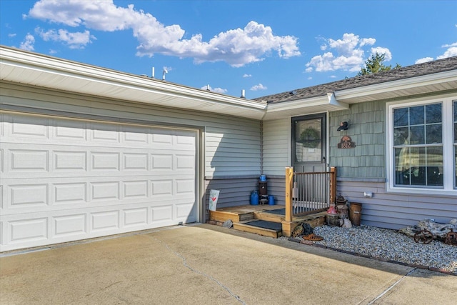 view of exterior entry with a garage