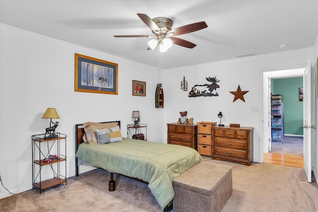 carpeted bedroom with ceiling fan