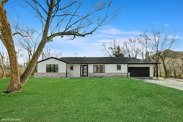 ranch-style house featuring a garage and a front yard