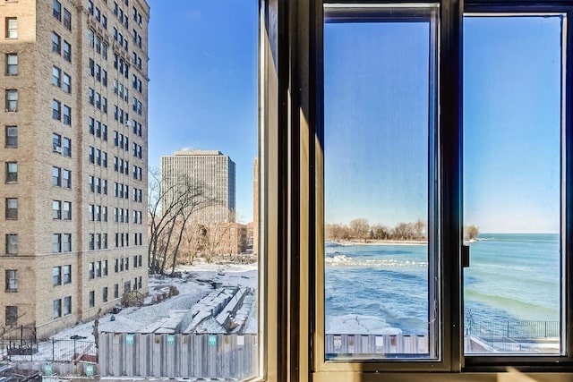 doorway to outside featuring a water view