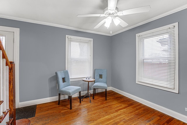 sitting room with crown molding, ceiling fan, and light hardwood / wood-style floors