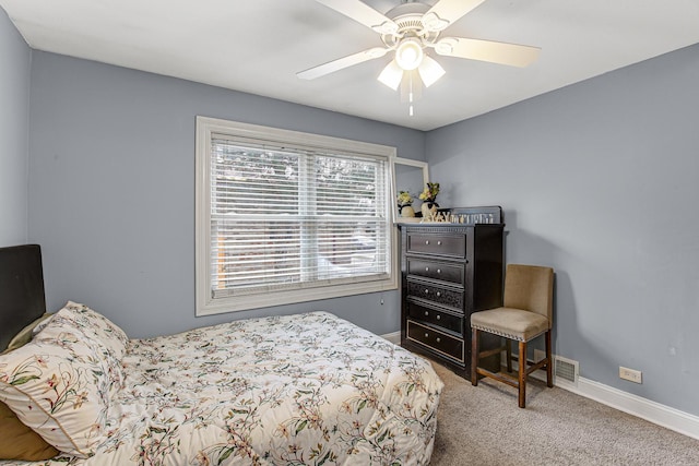 carpeted bedroom with ceiling fan