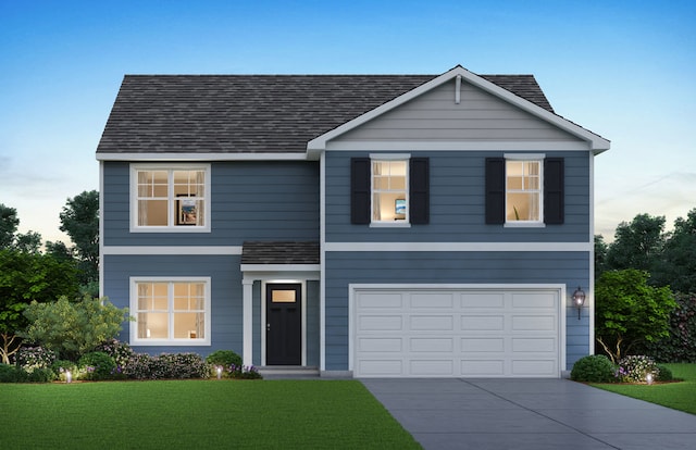 view of front facade with a garage and a front yard