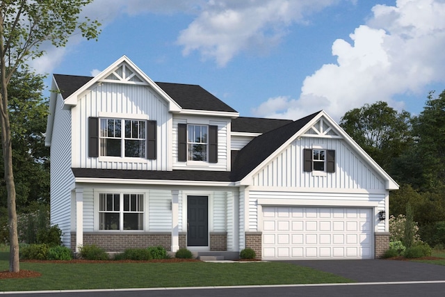 view of front facade featuring a garage and a front yard