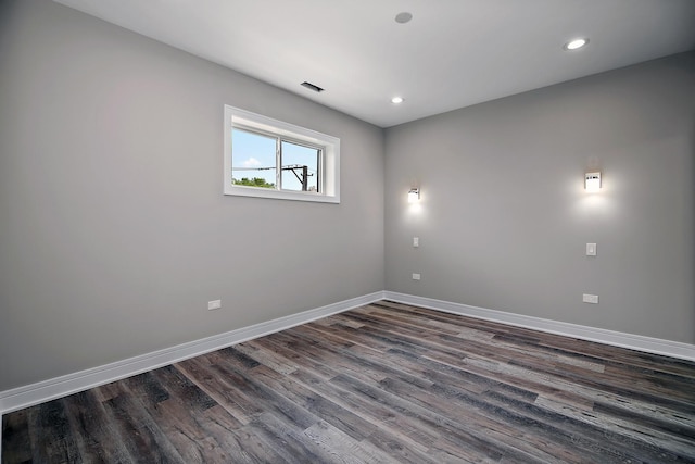 unfurnished room with dark hardwood / wood-style floors