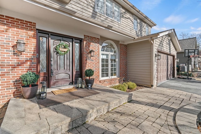 doorway to property featuring a garage