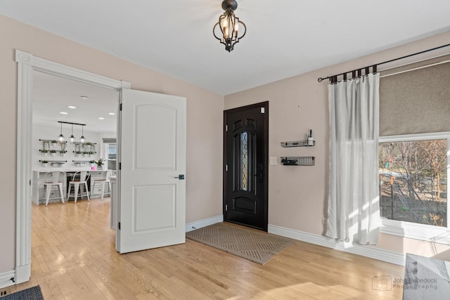 entryway with light hardwood / wood-style flooring