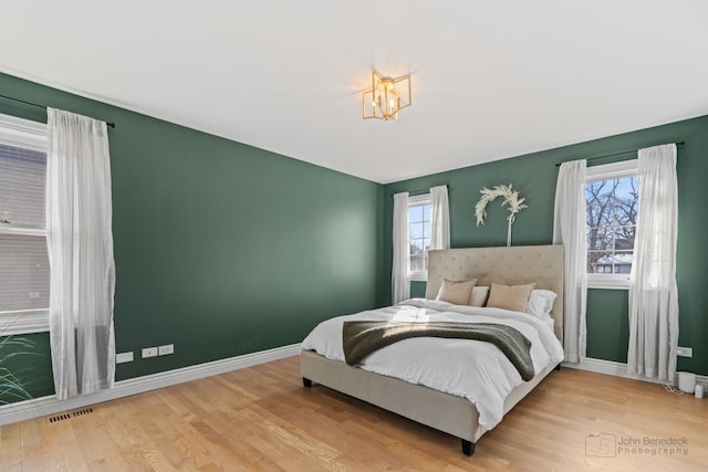 bedroom featuring wood-type flooring