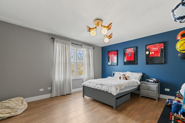 bedroom with light wood-type flooring