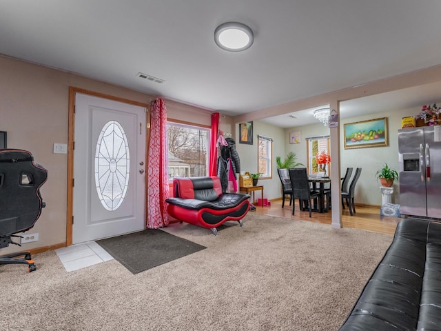 view of carpeted foyer