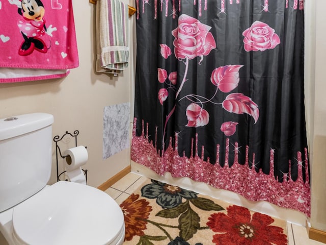 bathroom featuring tile patterned floors and toilet