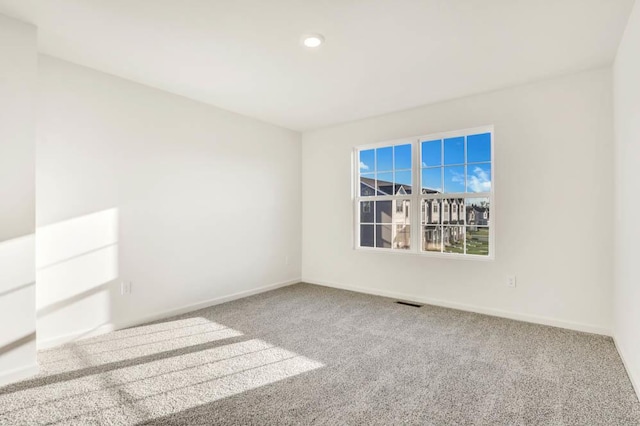 empty room featuring carpet flooring