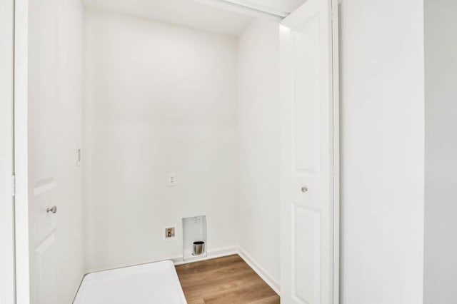 clothes washing area with hookup for a washing machine and hardwood / wood-style floors