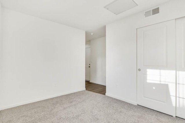 unfurnished room featuring carpet