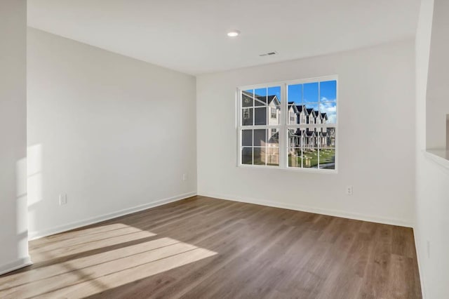 unfurnished room with light hardwood / wood-style flooring