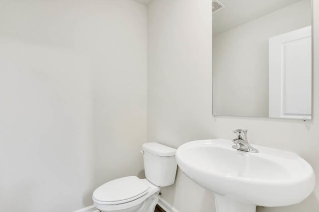 bathroom featuring sink and toilet