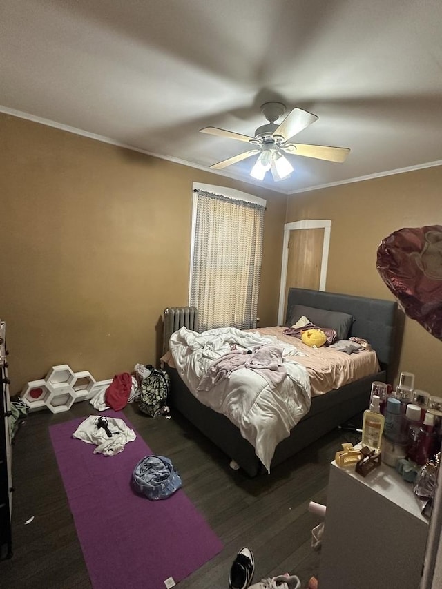 bedroom featuring crown molding, ceiling fan, and radiator