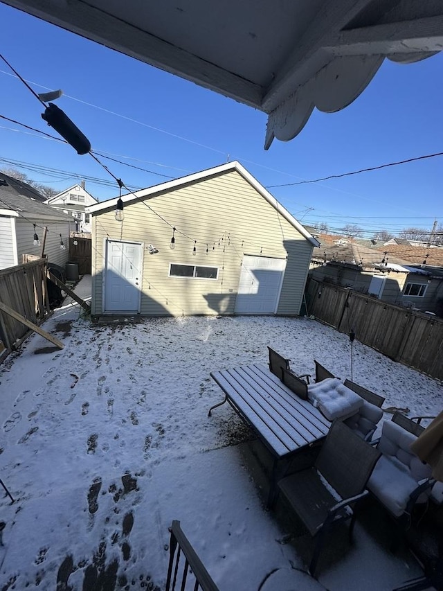 exterior space with a garage and an outbuilding