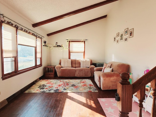 living room with dark hardwood / wood-style flooring, lofted ceiling with beams, and a textured ceiling