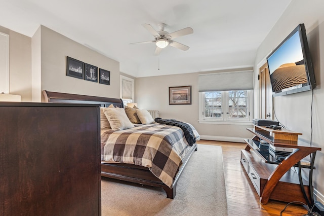 bedroom with ceiling fan and light wood-type flooring