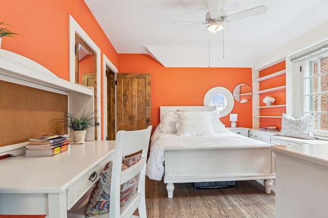 bedroom with hardwood / wood-style flooring and ceiling fan