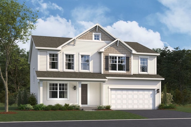 view of front of home featuring a garage and a front lawn