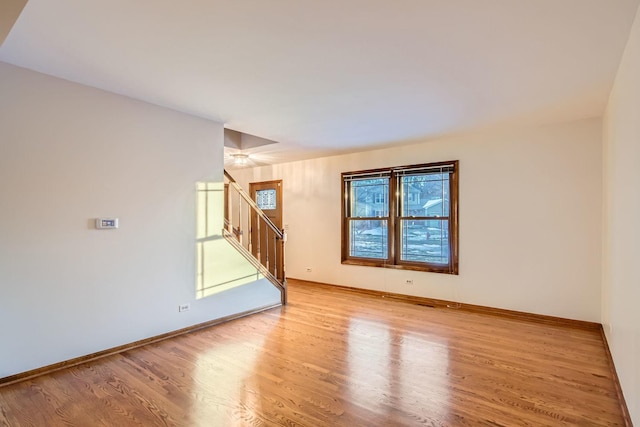 unfurnished room with a healthy amount of sunlight and light wood-type flooring