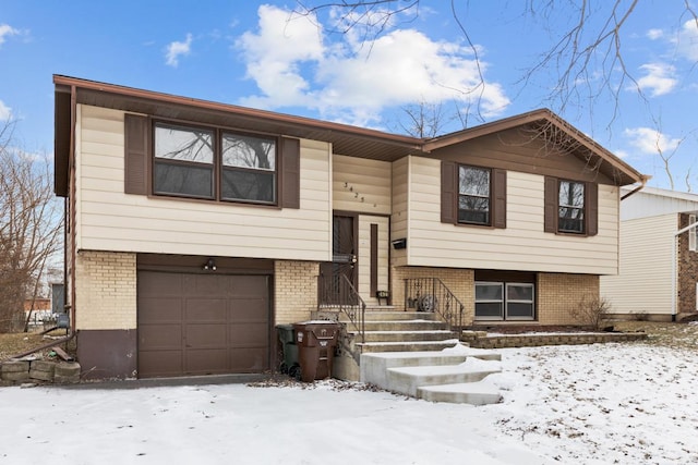 split foyer home featuring a garage