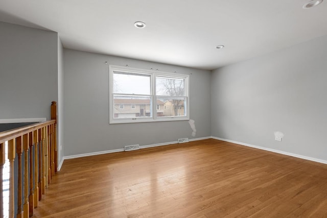 unfurnished room featuring wood-type flooring