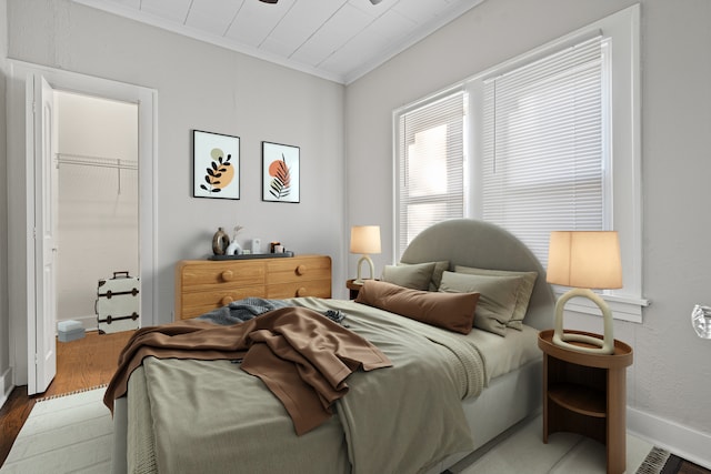 bedroom featuring crown molding and hardwood / wood-style floors