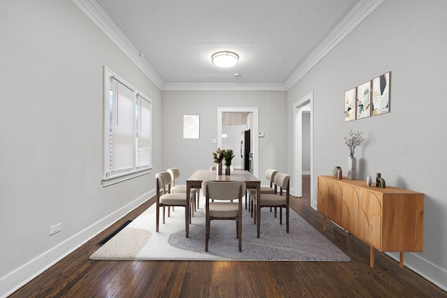 dining space featuring dark wood-type flooring and ornamental molding