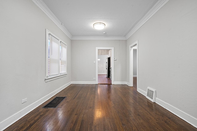 unfurnished room with ornamental molding and dark hardwood / wood-style flooring