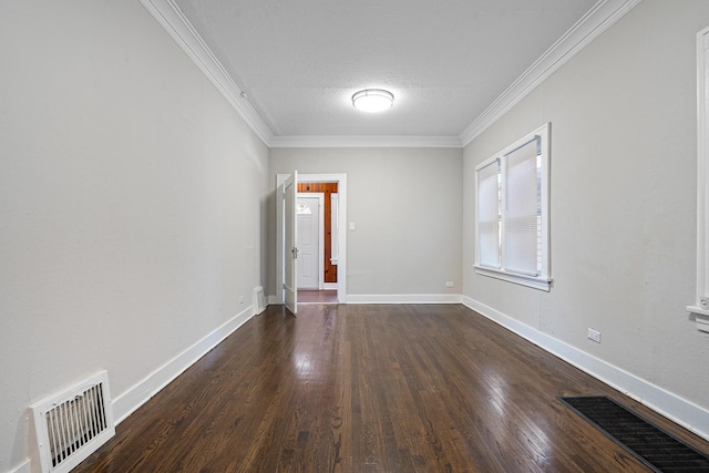 unfurnished room featuring crown molding, dark hardwood / wood-style floors, and a textured ceiling