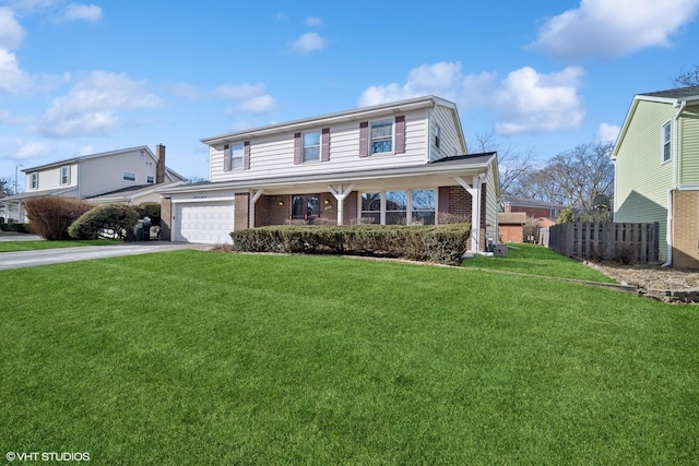 front of property featuring a garage and a front lawn