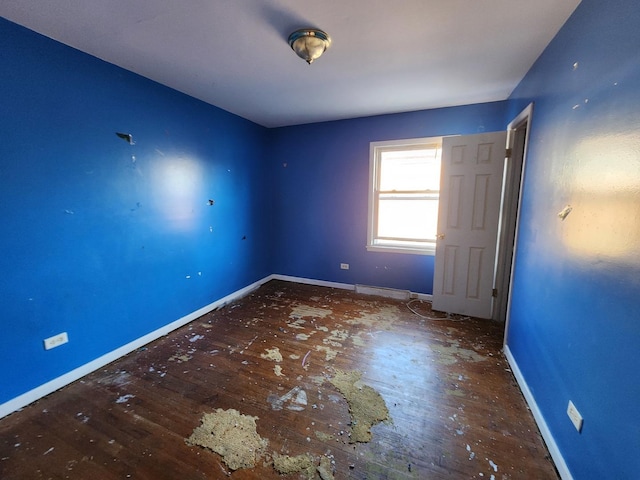 spare room featuring hardwood / wood-style flooring