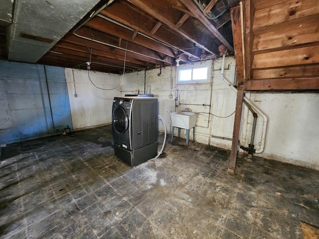 basement with washer / clothes dryer and sink