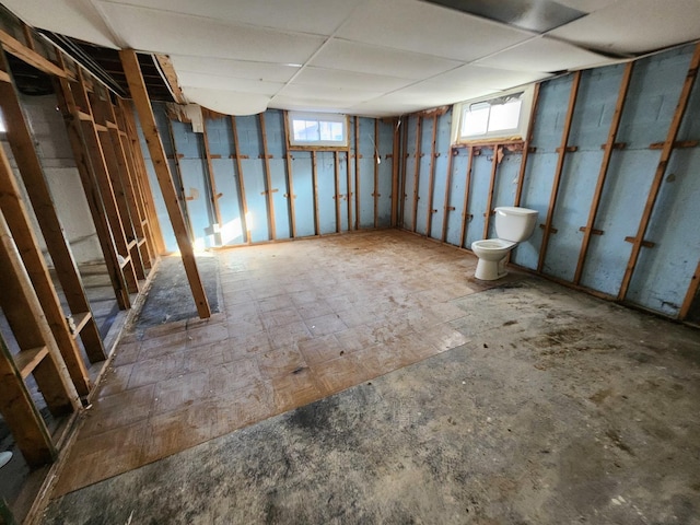 basement with a paneled ceiling