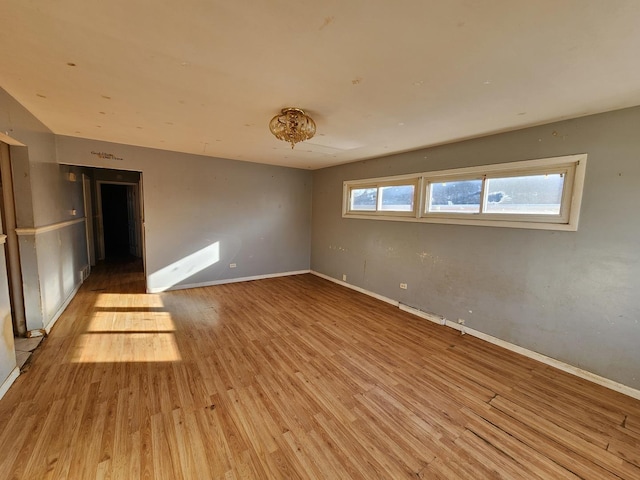 empty room with light hardwood / wood-style floors