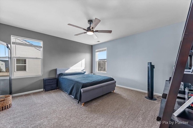 bedroom featuring ceiling fan and carpet