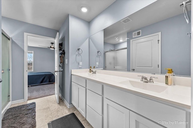 bathroom with vanity, ceiling fan, and walk in shower