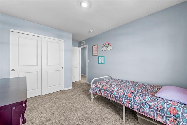 carpeted bedroom featuring a closet