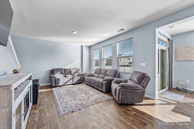 living room with dark wood-type flooring