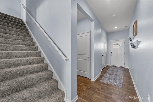 foyer with dark hardwood / wood-style flooring