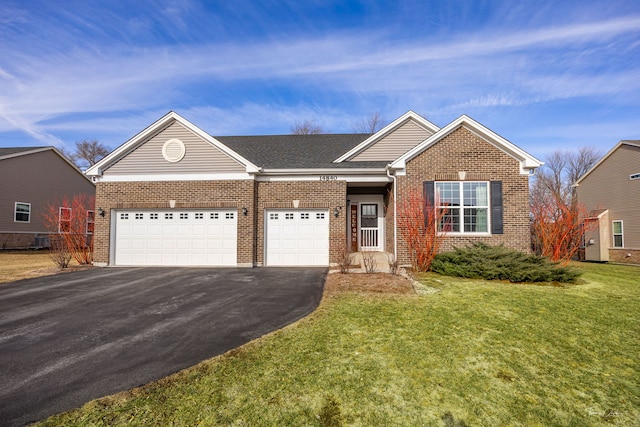 ranch-style house with aphalt driveway, brick siding, roof with shingles, a front yard, and a garage