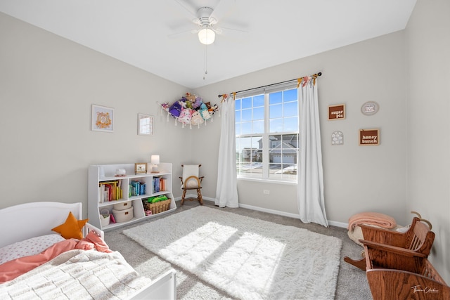 recreation room featuring carpet floors, baseboards, and a ceiling fan