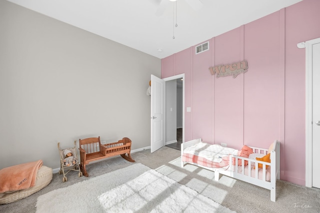 bedroom featuring light colored carpet, visible vents, ceiling fan, and baseboards