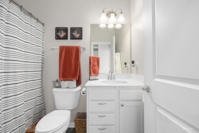 full bath featuring toilet and vanity