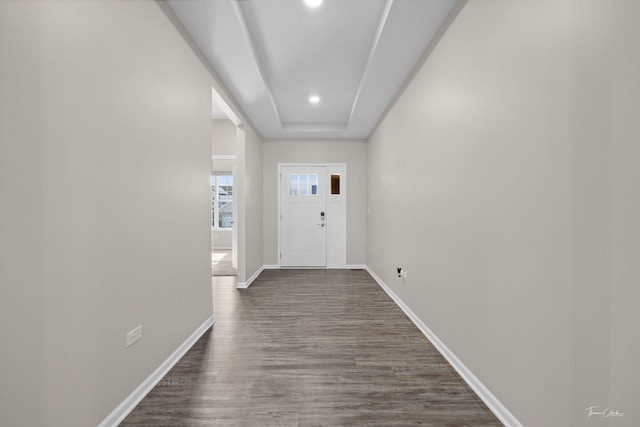 doorway with baseboards, dark wood finished floors, and recessed lighting